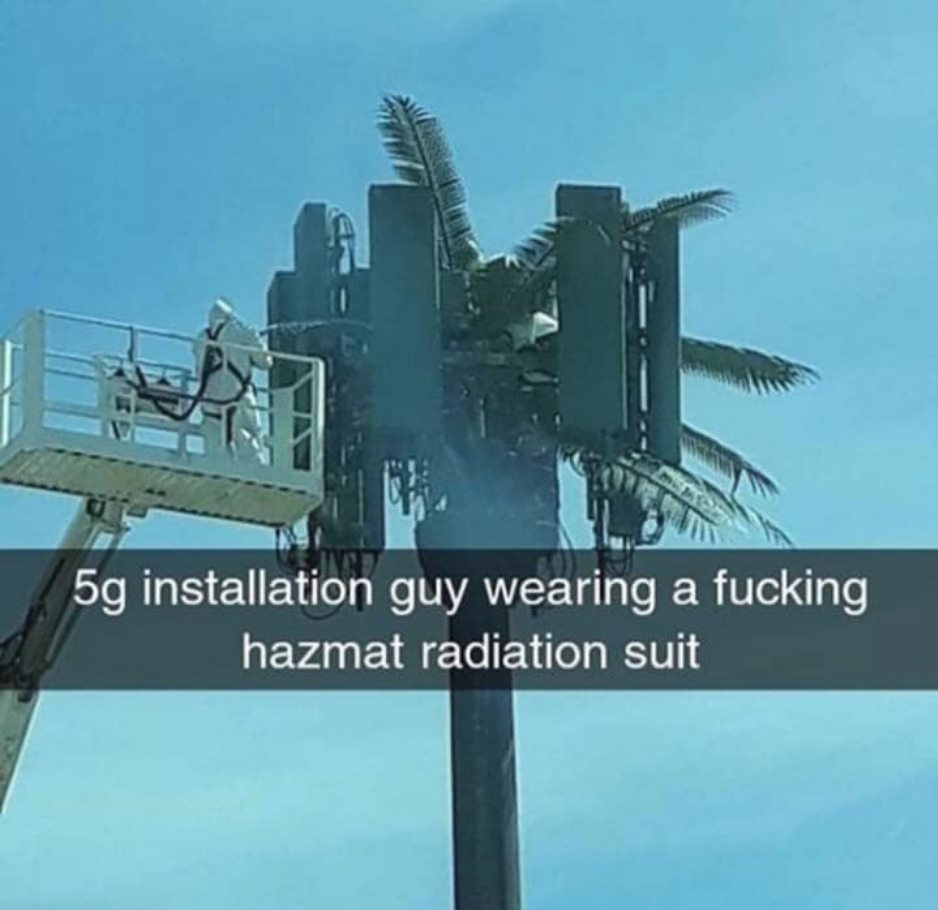 Man In HazMat Radiation Suit On 5G Tower