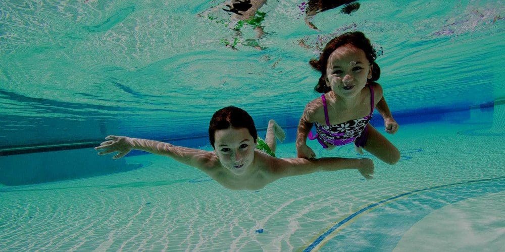 Kids Swimming In Pool