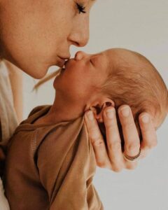 Mother Kissing Baby