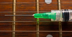 Syringe On Guitar