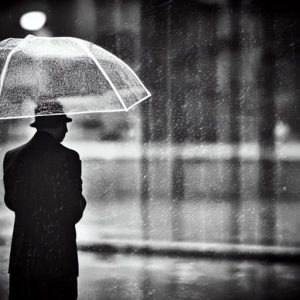 Man With Umbrella In Rain