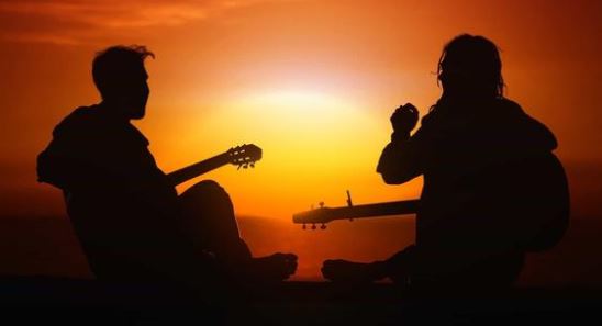 Guitarists At Sunset