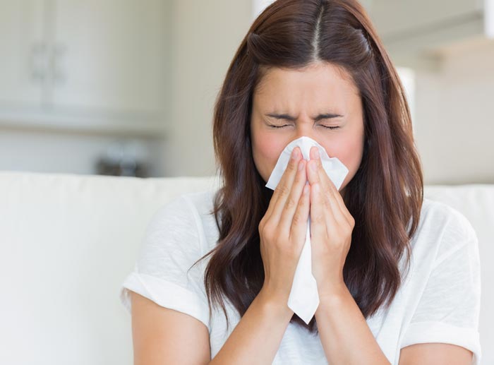 Women Sneezing