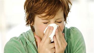 Woman Blowing Nose