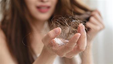 Woman and Lost Hair  In Hand
