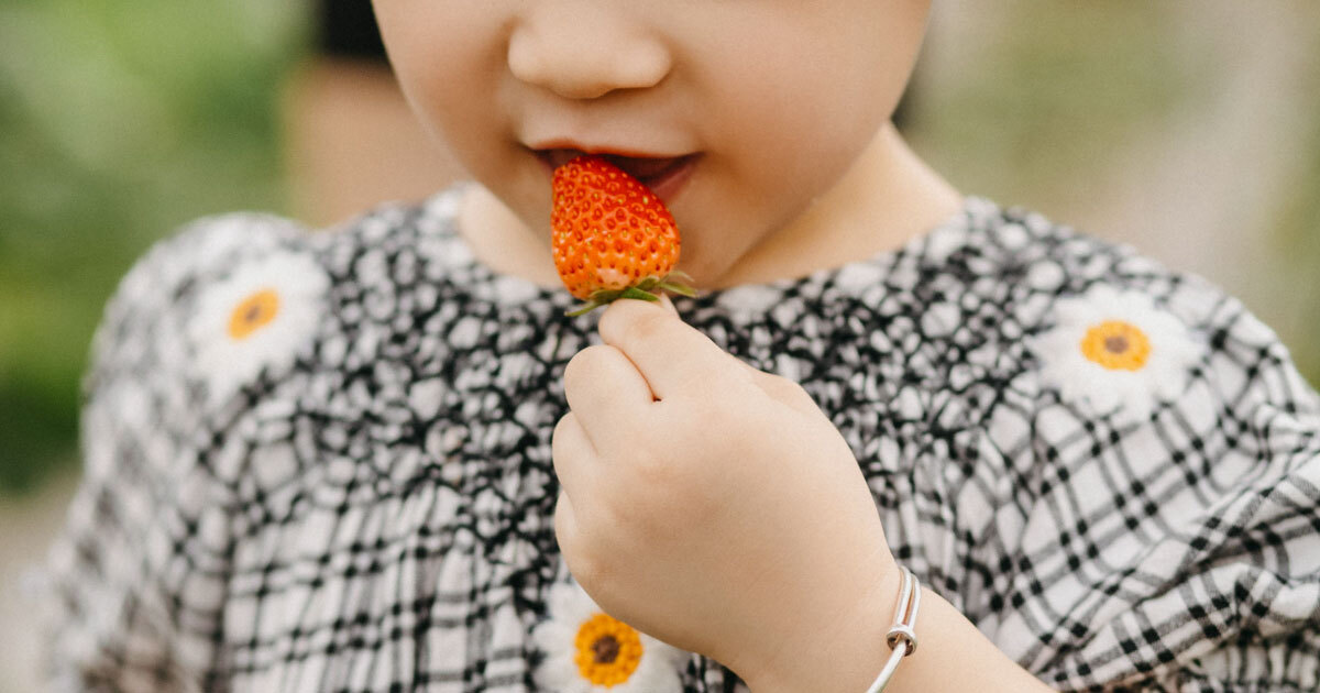 Child Eating Strawberry